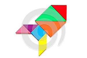Color wood tangram in rocket or missile shape on white background