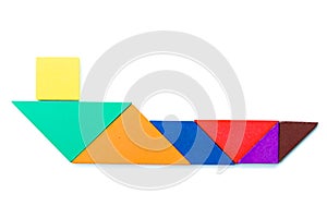 Color wood tangram in ship shape on white background