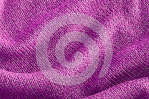 Color of the year 2022 soft knitted sweater texture closeup. Light ultra violet abstract background