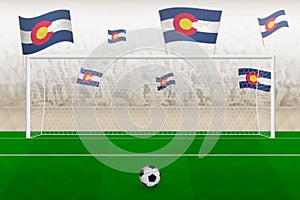 Colorado football team fans with flags of Colorado cheering on stadium, penalty kick concept in a soccer match