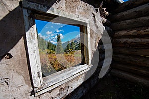 Colorado Landscape framed in Old Window Frame Cabin Ruins near C