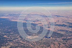 Colorado Rocky Mountains Aerial panoramic views from airplane of abstract Landscapes, peaks, canyons and rural cities in southwest