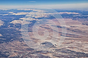 Colorado Rocky Mountains Aerial panoramic views from airplane of abstract Landscapes, peaks, canyons and rural cities in southwest