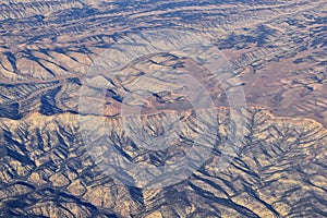 Colorado Rocky Mountains Aerial panoramic views from airplane of abstract Landscapes, peaks, canyons and rural cities in southwest