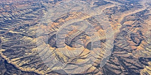 Colorado Rocky Mountains Aerial panoramic views from airplane of abstract Landscapes, peaks, canyons and rural cities in southwest