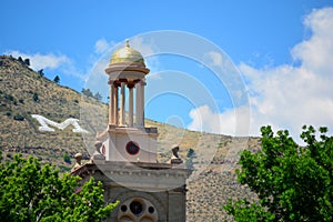 Colorado School of Mines Guggenheim Hall tower on a sunny day with a large letter M on the mountains in the background photo