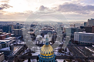 Colorado State Capitol Building & the City of Denver Colorado at Sunset. Rocky Mountains on the Horizon