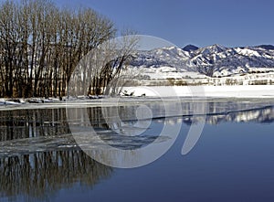 Colorado Winter Landscape with Frozen Lake and Snowy Mountains