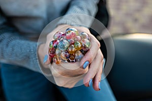 Colored antistress toy in the hand of a beautiful young woman