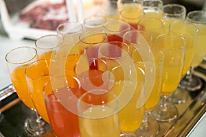 Colored aperitifs in glass glasses