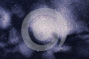 Colored asphalt surface with the shadow of tree branches. Abstract background