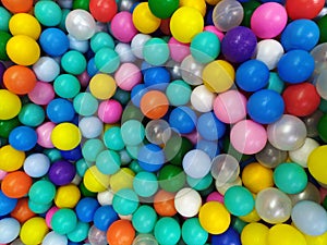 Colored balloons. Blue balloons. Bright background colors. Top view of the many colorful balls in the pool on the indoor