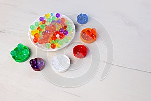 Colored balls of hydrogel, kids game, education concept