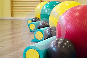 Colored balls and rollers for pilates classes