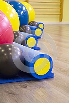 Colored balls and rollers for pilates classes