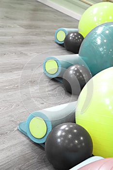 Colored balls and rollers for pilates classes