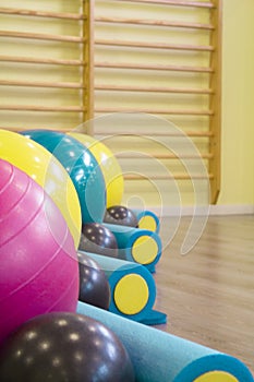 Colored balls and rollers for pilates classes