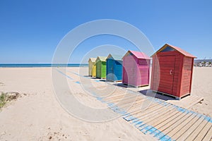 Colored bathing cabins at Beach in Grao of Castellon photo
