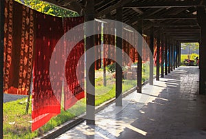 Colored Batik textile hanging to dry in Mataram, Lombok