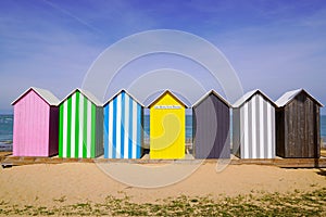 Colored beach huts La Bree-les-Bains city on beach oleron french isle