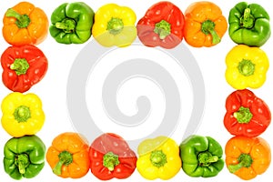 Colored bell peppers on white background