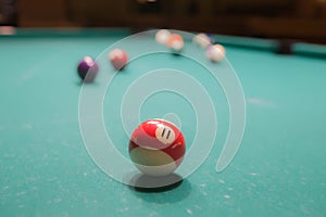 Colored billiard balls on a pool table