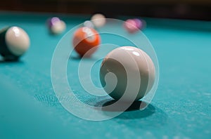 Colored billiard balls on a pool table