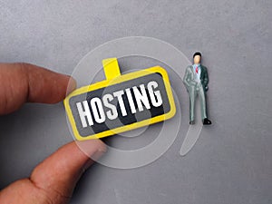colored board with the word HOSTING