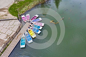 Colored boats docked, ready for tourists