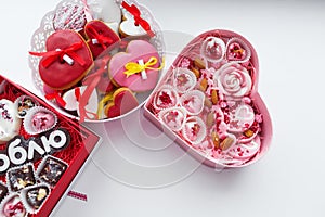 Colored boxes in the shape of a heart with colorful cake inside. Valentine`s Day Gift