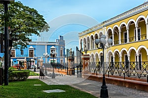 Colored buildings with colonnades  in Campeche, Mexico photo