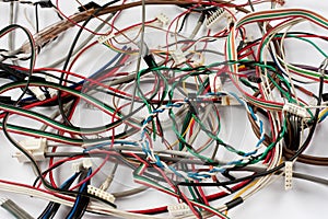 Colored cables and wires with connectors on white background.