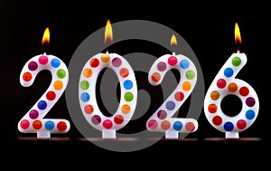 Colored candles write numbers flame Happy new year 2026