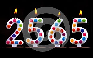 Colored candles write numbers flame Thailand new year 2565