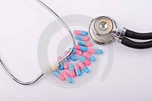 Colored capsules and stethoscope
