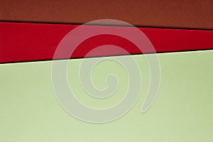 Colored cardboards background in green red brown tone. Copy spac