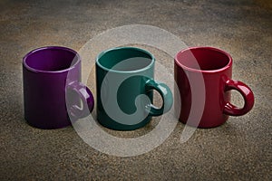 Colored ceramic mugs close up