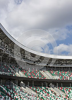 Colored chairs Empty tribuns of a modern stadium without spectators