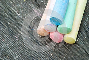 Colored chalk for drawing on a wooden background