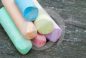 Colored chalk for drawing on a wooden background
