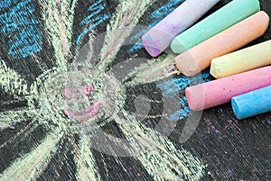 Colored chalk for drawing on a wooden background