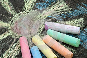 Colored chalk for drawing on a wooden background