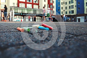 Colored chalk on playground with drawings on street.children drawing on the street. drawing lessons and creativity for