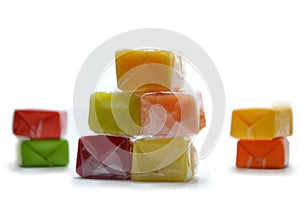 Colored chewing sweets on white background