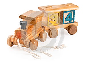 Colored children`s wooden toy train with digit cubes, isolated on a white background