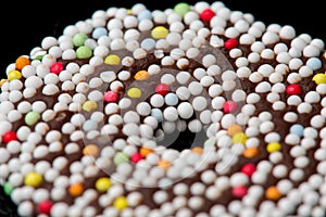 Chocolate biscuits rings on black background