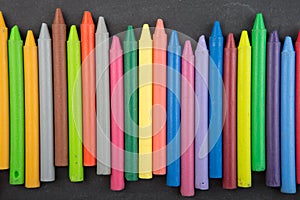 colored crayons on the blackboard