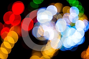 Colored defocused lights background. Abstract bokeh lights