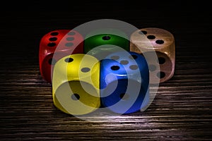 Colored dice dark background