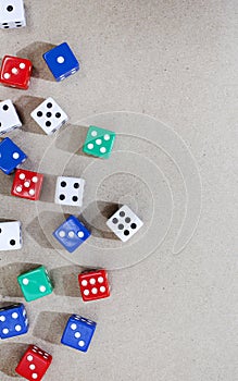 colored dice framing the side of a neutral surface